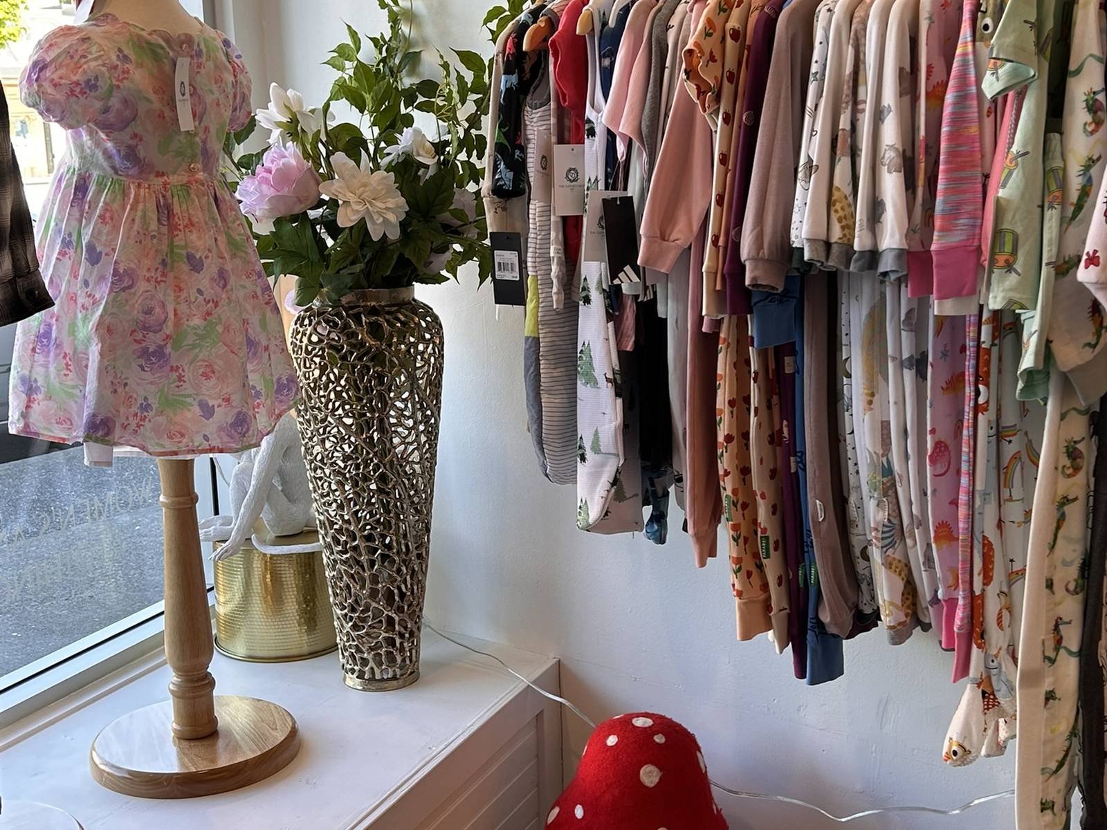 The children's rail at The Clothes Nest, by the window on Main Street.