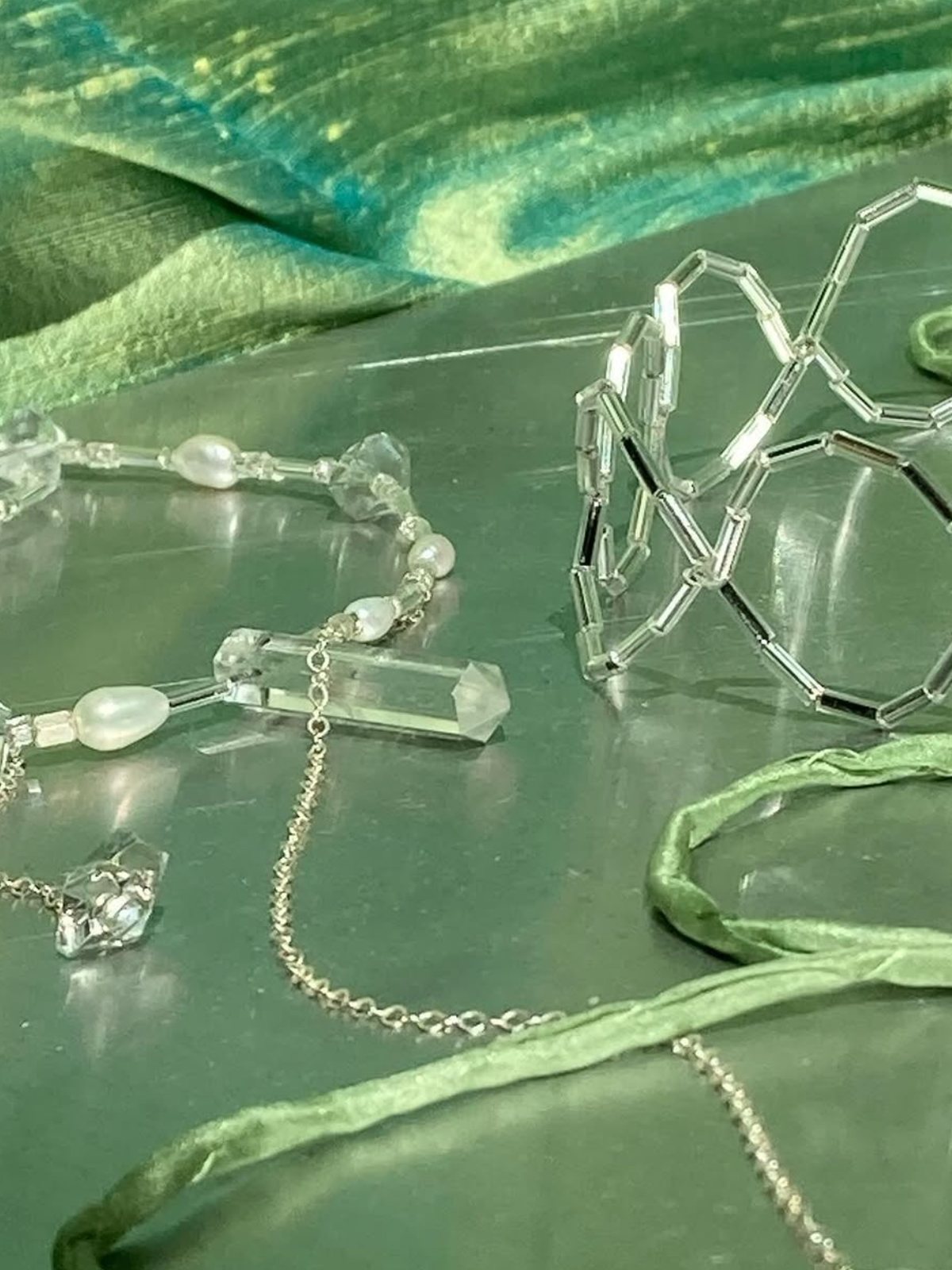 Eudaimonic jewellery — quartz points, freshwater pearls and beadwork on silk.